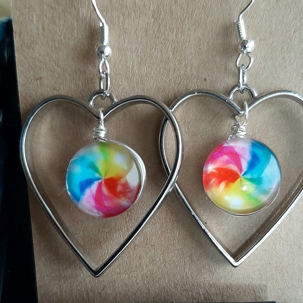 large rainbow swirl double sided mandala glass drop earrings enclosed in a silver metal heart