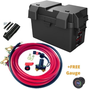 May include: A black battery box with a red and black cable set, a red toggle switch, and a black and red battery terminal. The box has a label that says "24-31 Smart Box Battery Box UV", and the set includes a free digital voltage gauge.