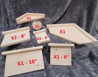 Puede incluir: Surtido de estantes de madera para jaulas de animales pequeños. Los estantes están hechos de madera natural y vienen en varios tamaños, incluyendo 4 pulgadas, 6 pulgadas, 8 pulgadas y 10 pulgadas. Los estantes están etiquetados con la cantidad y el tamaño.