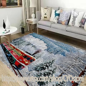 May include: A blue and white area rug with a red and yellow train traveling through a snowy forest scene.