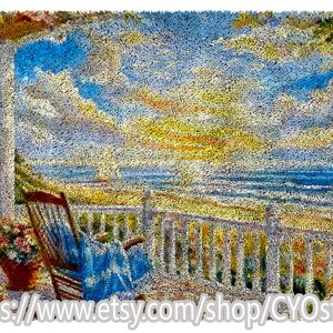 May include: A textured rug depicting a seaside scene with a rocking chair on a porch. The sky is a mix of blue, yellow, and orange, with a view of the ocean and a sailboat. A flower pot sits near the chair.