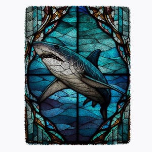 May include: A stained glass window design featuring a shark swimming in blue water. The shark is white with gray markings and has a sharp fin. The window is framed in a dark brown border with intricate details.