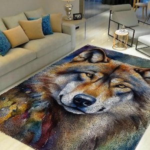 May include: A colorful rug with a close-up image of a wolf's face. The wolf's fur is brown, gray, and white, and its eyes are yellow. The rug has a textured, fuzzy surface.