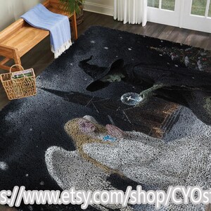May include: A large, rectangular area rug with a fantasy theme. The rug features a dark, starry background with illustrations of a witch and an angel. The witch is wearing a black hat and cloak, and the angel has white wings. The rug is made of a soft, plush material.