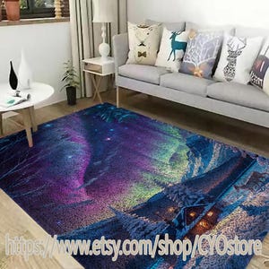 May include: A purple, blue, and green area rug with a snowy mountain scene and a cabin with lights. The rug has a starry sky and a swirling aurora borealis effect.
