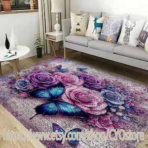May include: A purple and blue floral area rug with a large butterfly design. The rug features a detailed illustration of roses and butterflies on a textured background.