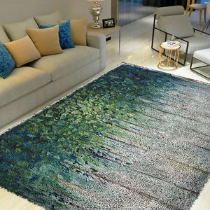 Könnte beinhalten: Ein abstrakter Teppich in Grün und Blau mit weißem Hintergrund. Der Teppich hat eine flauschige Textur und ein modernes Design.