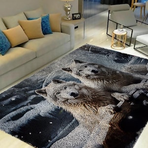 May include: A gray and black area rug with a design of two white wolves in a snowy forest setting.
