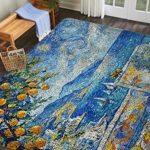 May include: A large, rectangular area rug featuring a vibrant, impressionistic design. The rug showcases a blue and yellow color palette with a landscape scene, including trees with orange fruit, mountains, and a starry sky. The rug is placed on a wooden floor.