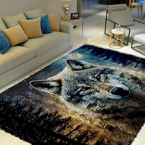 May include: A rectangular area rug featuring a detailed image of a wolf's face. The rug has a dark blue and black background with a forest and starry night design. The wolf's fur is gray and white.