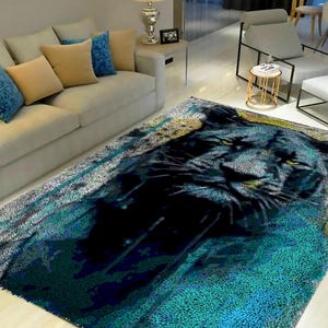 May include: A black panther rug with a blue, green, and yellow abstract background. The rug is made of soft, plush material and features a realistic depiction of a panther's face.