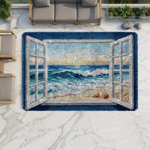 May include: A rectangular area rug featuring a textured, tufted design of an open window looking out onto a beach scene. The rug displays a blue ocean with white-capped waves, a sandy shore, and a light sky, framed by white window panes.