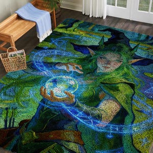 May include: A large, rectangular area rug featuring a fantasy illustration of a green-haired sorceress holding a glowing orb. The rug's design incorporates shades of green, blue, and brown, creating a mystical and artistic aesthetic. The rug is placed on a wooden floor.