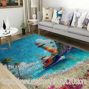 May include: A colorful area rug with a lighthouse, palm trees, and a boat on a blue ocean background. The rug has a textured, pebble-like surface.