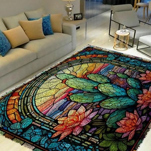 May include: A colorful stained glass style rug with a design of cacti and flowers. The rug has a rainbow background with a circular design in the center.