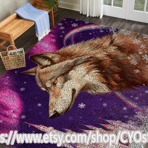 May include: A purple area rug featuring a detailed illustration of a wolf's head. The rug has a winter theme with snowflakes, a rainbow, and a castle design. The wolf is brown and white, set against a purple and pink background.