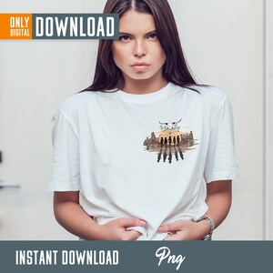 May include: A white t-shirt with a graphic design of a sunset scene with a skull and crossbones and the text "Hasta La Vista" in a western style font.