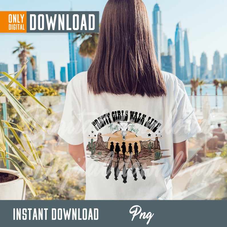 May include: White t-shirt with a graphic print of a sunset scene with cacti and the text "Pretty Girls Walk Like This".