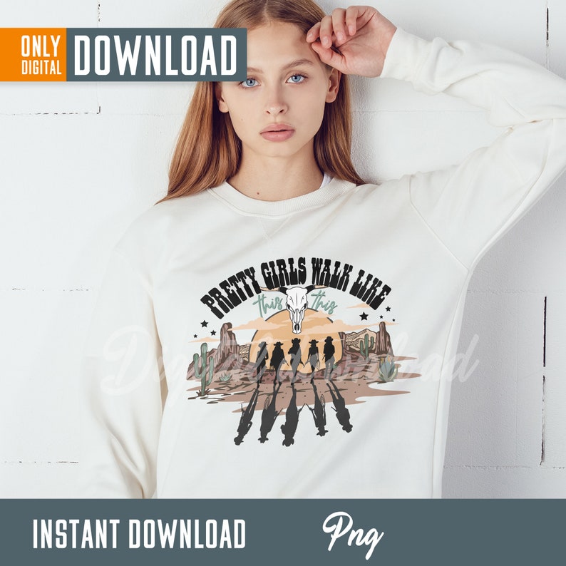 May include: White sweatshirt with a graphic print of a sunset scene with cowboys and the text "Pretty Girls Walk Like This" with a skull and crossbones.
