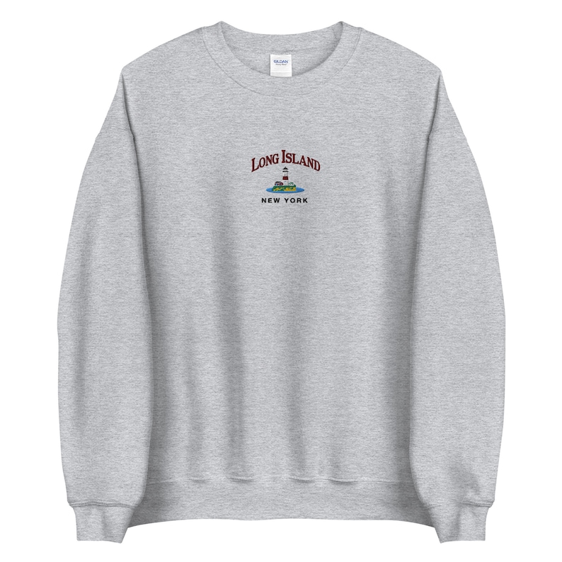 May include: Gray sweatshirt with a maroon embroidered design that says "Long Island, New York" with a lighthouse and island graphic.