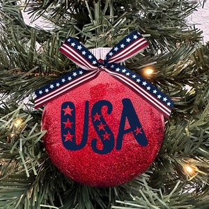 USA Patriotic America Flag Stars and Stripes United States Freedom God Bless Glass Disc Red Glitter Christmas Holiday Tree Ornament with Bow