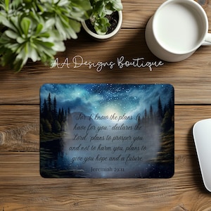 May include: A blue and white mouse pad with a starry night sky and forest scene. The text "For I know the plans I have for you." - declares the Lord, plans to prosper you and not to harm you, plans to give you hope and a future. Jeremiah 29:11" is printed on the mouse pad.