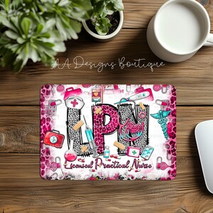 May include: A rectangular mousepad with a pink leopard print border and a design featuring medical symbols and the letters "LPN." The text "Licensed Practical Nurse" is also present. The design includes a stethoscope, syringe, and medical cross.