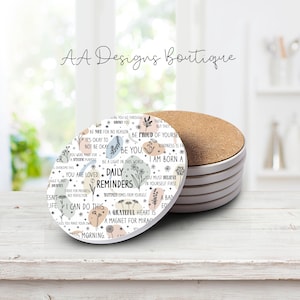 May include: A set of six round coasters with a white background and a floral design. The coasters feature inspirational quotes such as "Be proud of yourself", "Be a light in this world", "You are loved", "Daily Reminders", "I can do this", and "A grateful heart is a magnet for miracles".