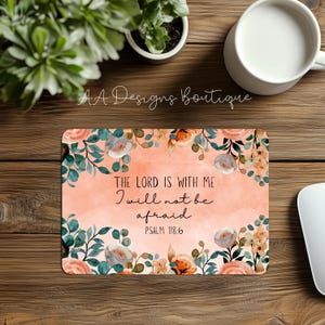 May include: Rectangular mousepad with a floral design and the text "THE LORD IS WITH ME I will not be afraid PSALM 118:6". The mousepad has a peach background with floral accents in shades of orange, blue, and white.