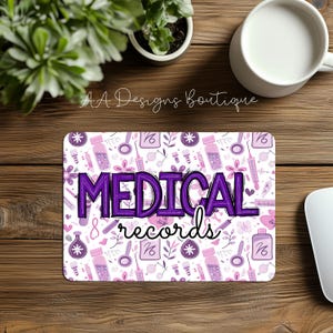 May include: A white mouse pad with a purple and pink pattern of medical symbols and the text "MEDICAL records".