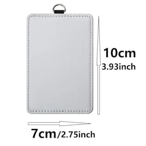 May include: A rectangular white badge holder with stitched edges and a silver metal D-ring at the top. The holder measures 3.93 inches in height and 2.75 inches in width, as indicated by the text and arrows displayed next to the object.
