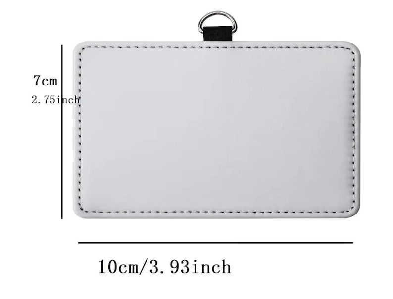 May include: A rectangular white badge holder with black stitching along the edges and a black fabric loop with a silver metal D-ring at the top. The dimensions are clearly marked as 2.75 inches in height and 3.93 inches in width.