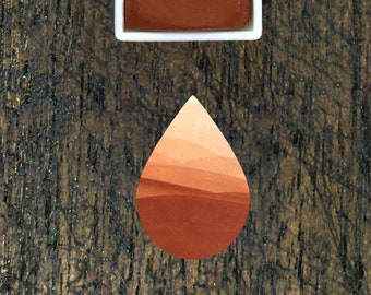 Rust Watercolour Half Pan. Reddish brown watercolor paint.