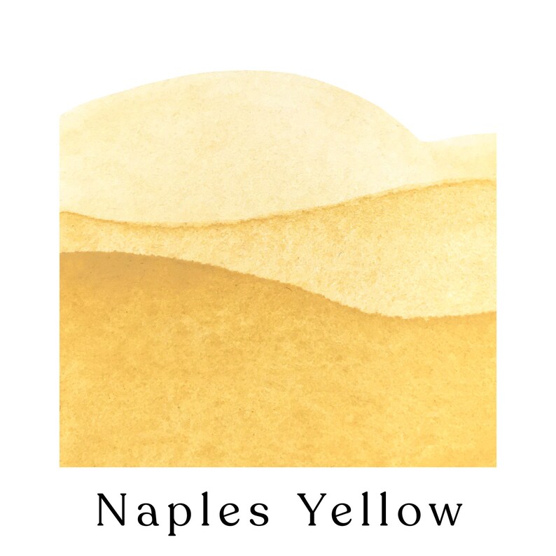 May include: A close-up of Naples Yellow watercolor paint. The paint is a bright, vibrant yellow with a slightly textured surface.