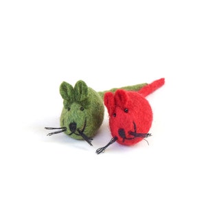 May include: Two felt mouse toys, one green and one red, with black eyes and whiskers.