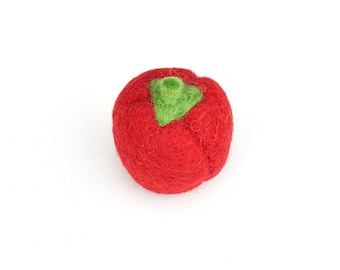 Può includere: Un pomodoro rosso in feltro con un gambo verde in feltro.