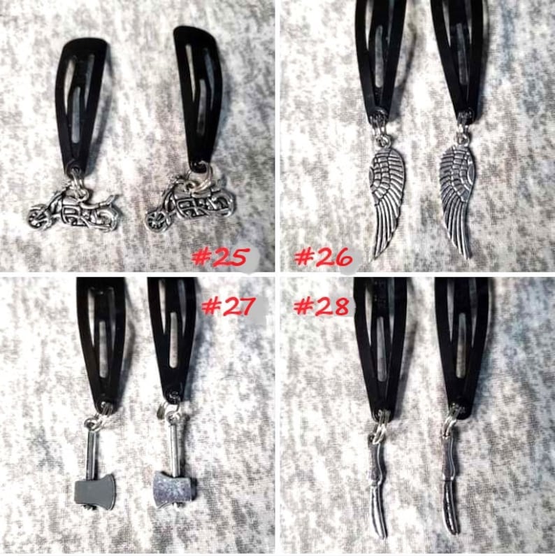 May include: Four pairs of black hair clips with different silver charms. The charms include a motorcycle, angel wings, an axe, and a knife. The clips are numbered 25, 26, 27, and 28.