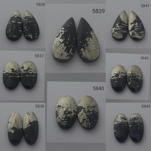 May include: Assortment of ten pyrite cabochons, each with a unique pattern of silver and black. The cabochons are in various shapes, including teardrop and oval. The cabochons are labeled with numbers 5836, 5837, 5838, 5839, 5840, 5841, 5842, 5843.
