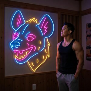 May include: A neon sign in the shape of a hyena's head, with blue, pink, and yellow lights, mounted on a wooden wall. The sign is the focal point of the room. A person is standing in front of the sign.