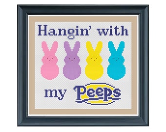 May include: Cross stitch pattern featuring four colorful Peeps marshmallow bunnies with the text "Hangin' with my Peeps".