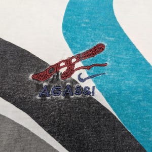 Rara polo da tennis vintage anni '90 di Andre Agassi Nike Boot immagine 2