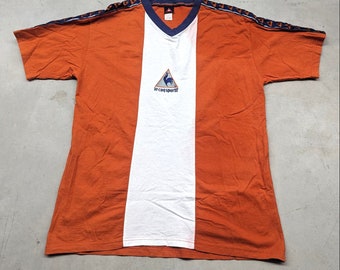 Vintage Le Coq Sportif Orange and White jersey style t-shirt