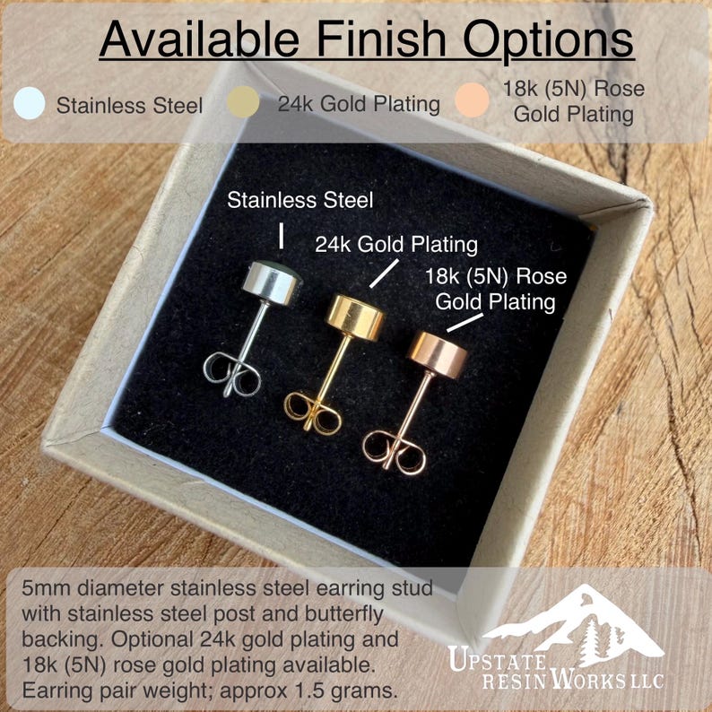 May include: A display of three stud earrings in a box, showcasing finish options: stainless steel, 24k gold plating, and 18k rose gold plating. Each earring has a 5mm diameter stud with a butterfly backing. The text reads "Available Finish Options."