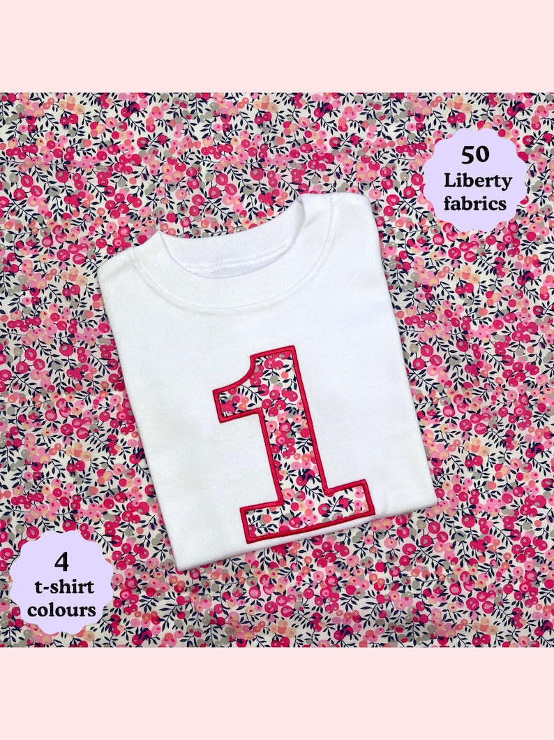 May include: A white t-shirt featuring a large number one appliqu&eacute; on the front. The number is filled with a pink, red, and white floral pattern and outlined in red stitching. Text on the image reads 50 Liberty fabrics and 4 t-shirt colours.