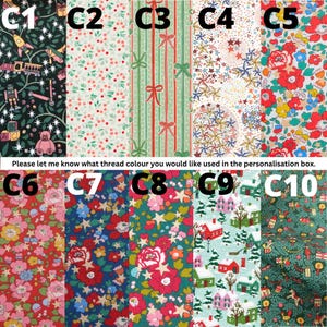 May include: A collection of ten fabric swatches labeled C1 through C10, featuring various patterns including toys on black, floral prints, striped ribbons, stars, and winter village scenes. Text reads: Please let me know what thread colour you would like used in the personalisation box.