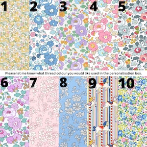 May include: A collection of ten fabric swatches featuring various floral patterns and one carousel horse print. The designs include yellow, blue, purple, pink, and multi-colored botanical motifs. Text reads: Please let me know what thread colour you would like used in the personalisation box.