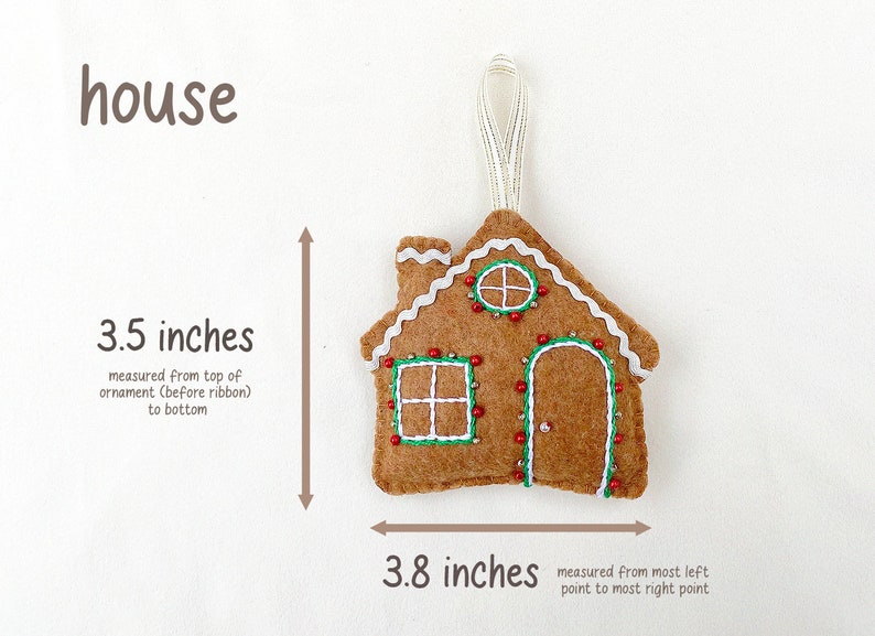 May include: A felt gingerbread house ornament with white icing, red bead lights, and green embroidery. The ornament is 3.5 inches tall and 3.8 inches wide.