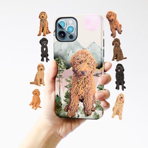 May include: A phone case with a watercolor design of mountains and trees. A brown dog with fluffy fur is sitting in the foreground. The case has a pink and white background.