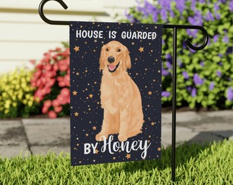 May include: A black and gold garden flag with a golden retriever dog sitting on a blue background with gold stars. The text on the flag reads "House is guarded by Honey".