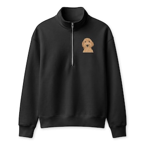 May include: A black quarter-zip sweatshirt featuring a small embroidered graphic of a golden-colored dog on the upper left chest. The garment has a high collar, a silver-toned metal zipper, long sleeves with ribbed cuffs, and a ribbed hemline.